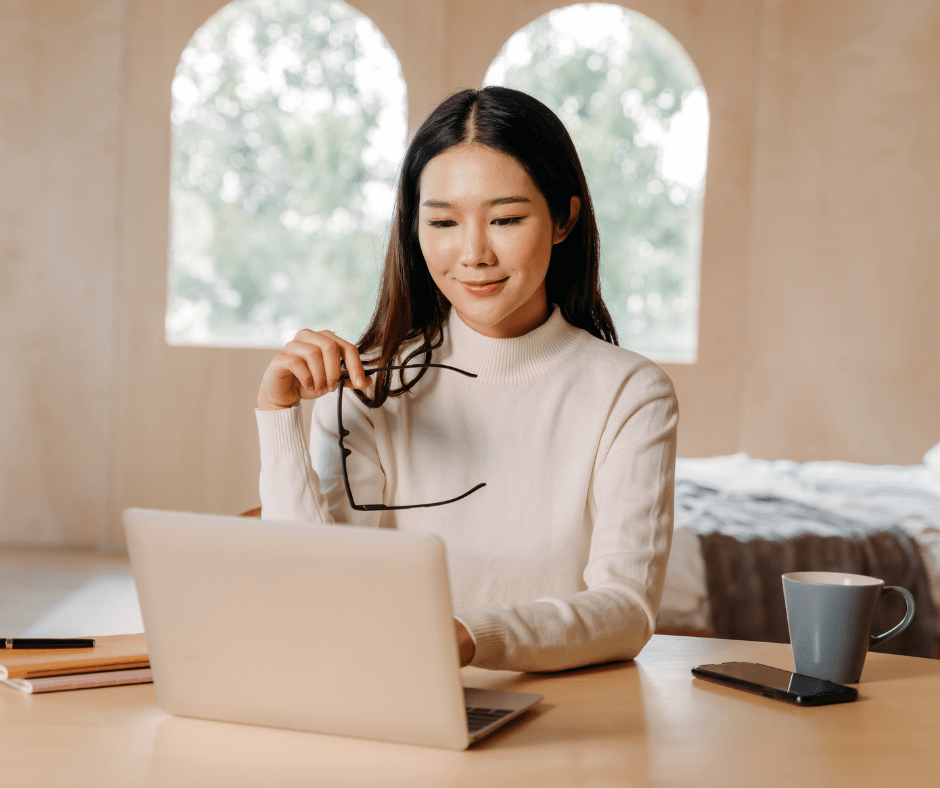 Business woman sitting at desk with computer