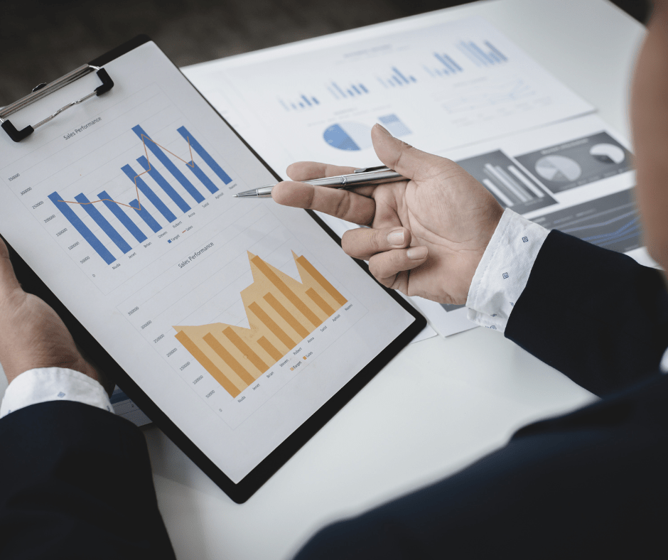 hand pointing to a graph chart